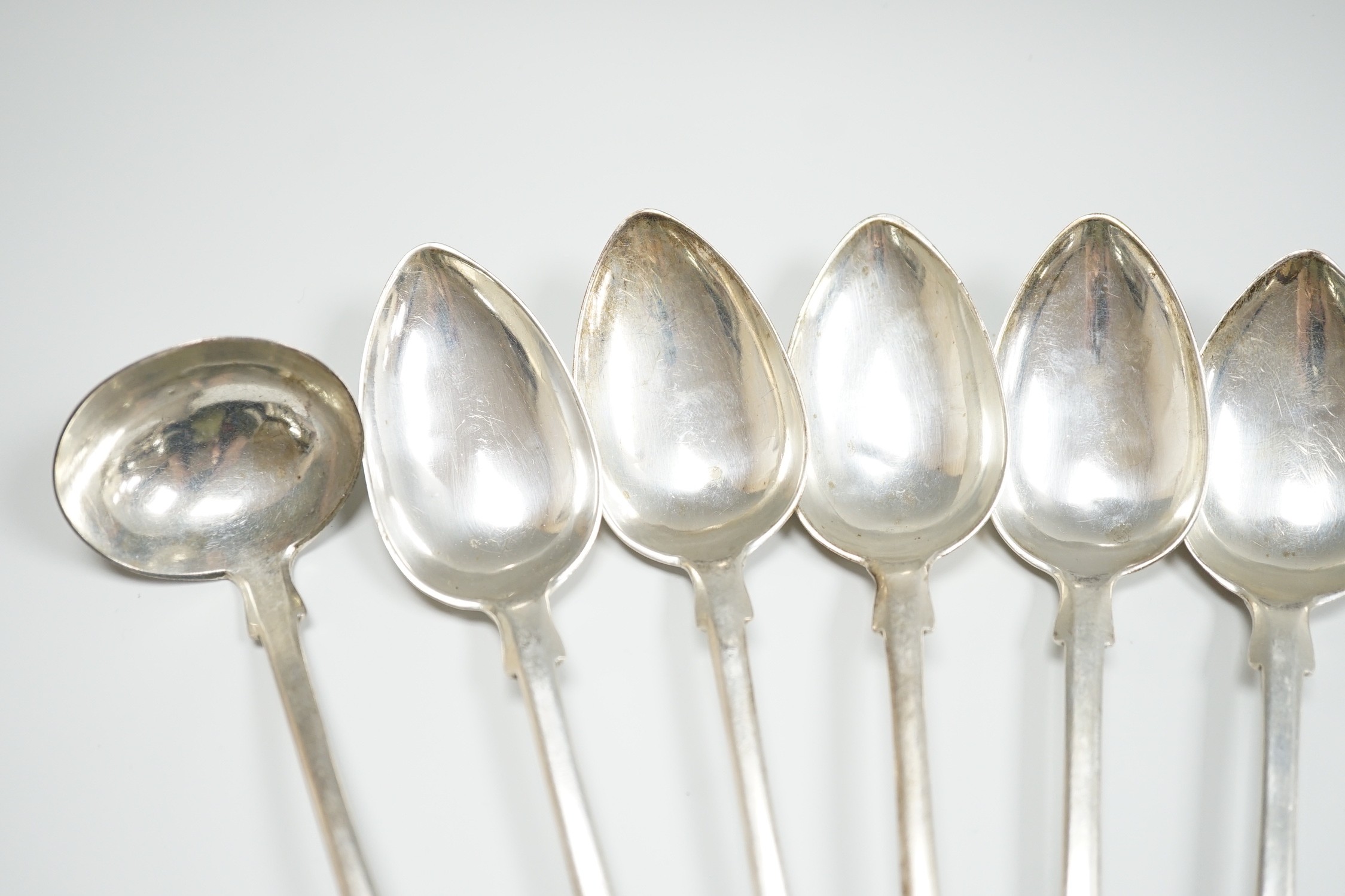 A set of nine early 19th century Scottish provincial silver fiddle pattern dessert spoons, 18.5cm and a pair of sauce ladles, by Alex MacLeod, Inverness, 11oz.
